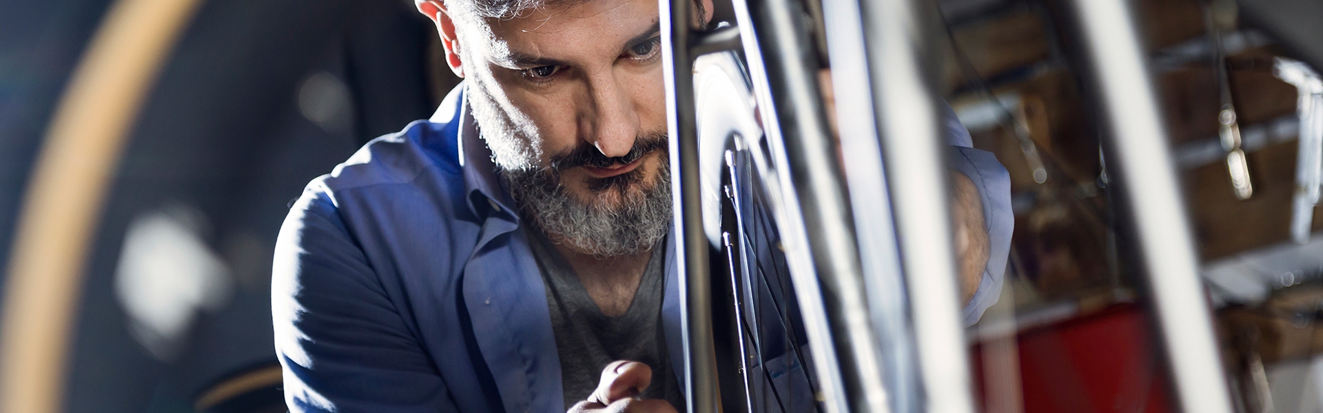 man working on bicycle