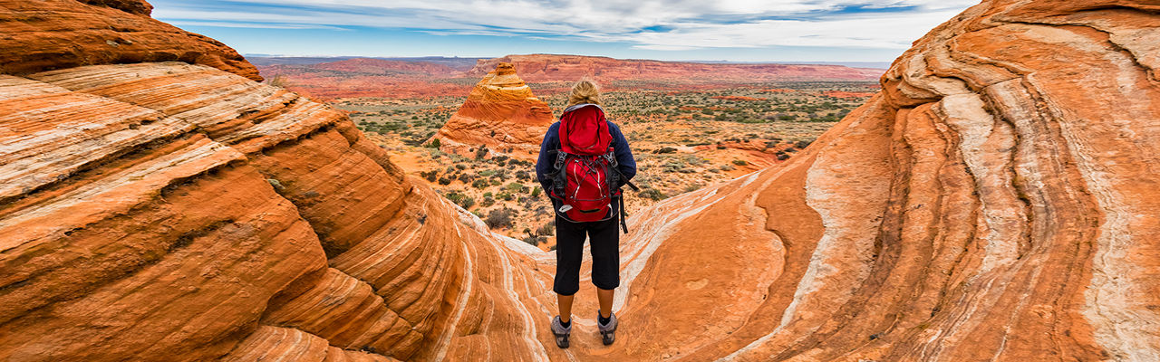 person hiking through the canyon