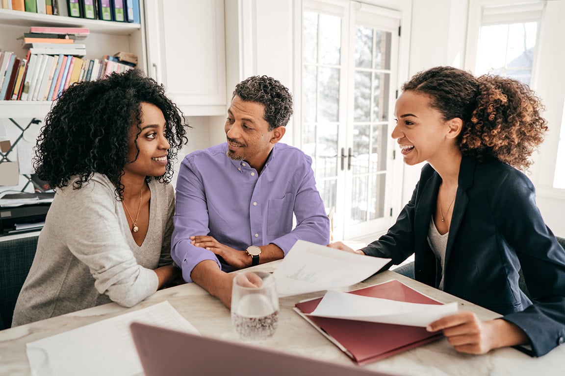 An advisor talks to a couple