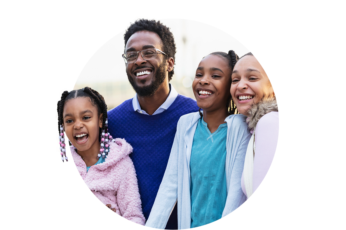 Family of 4 smiling together