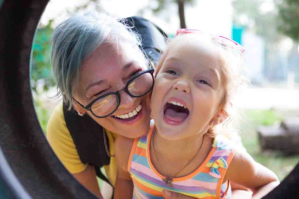 mother and daughter playing outdoors