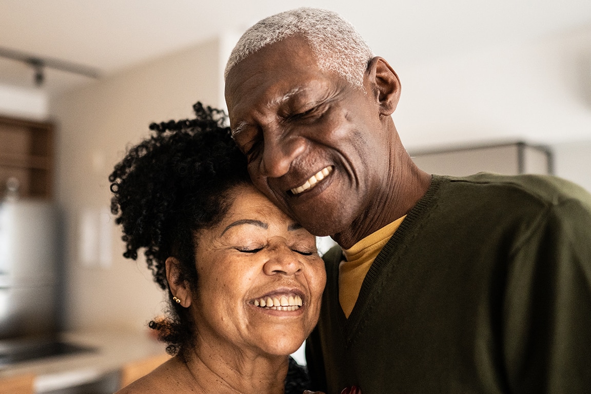 a man and a woman smiling at each other