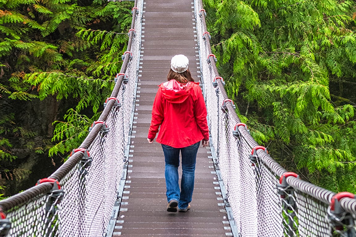 women walking through bridge