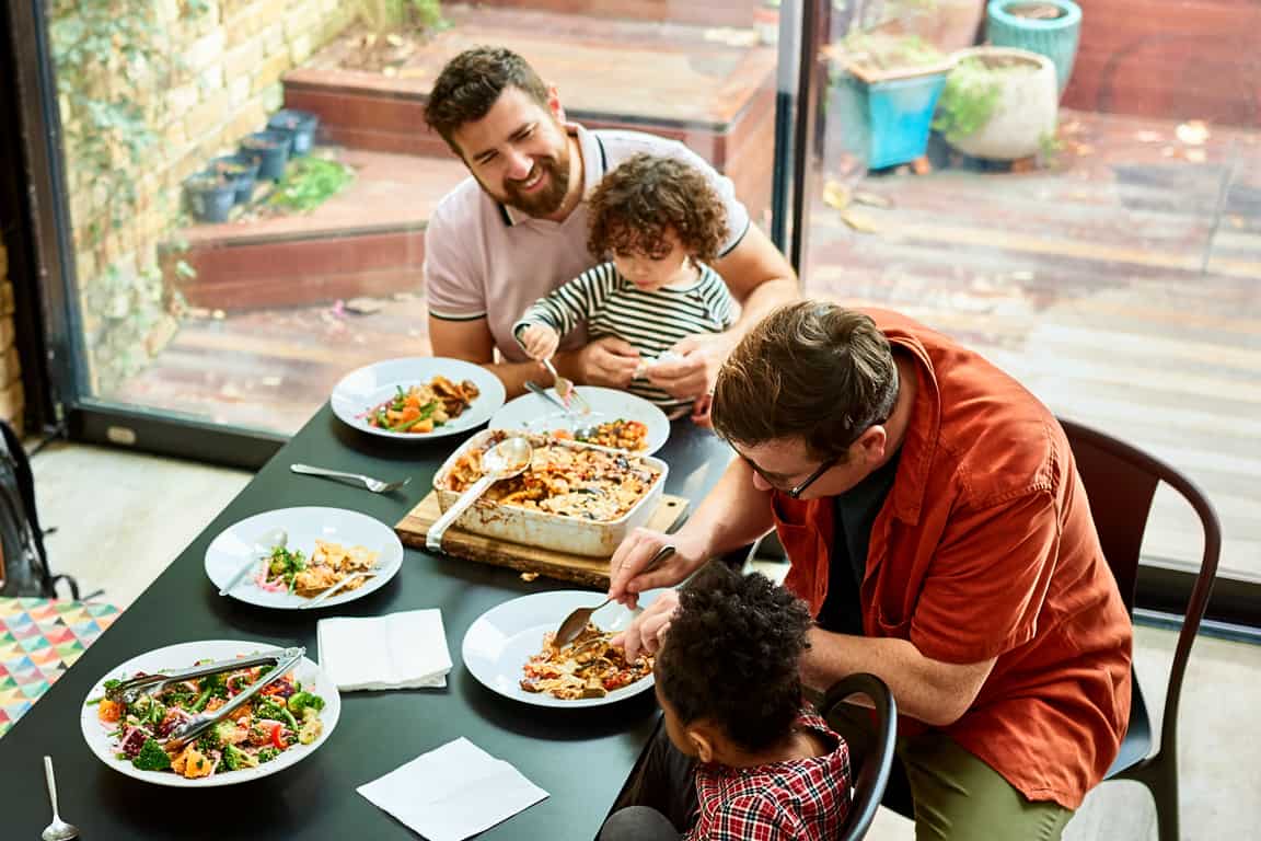 family with four having lunch