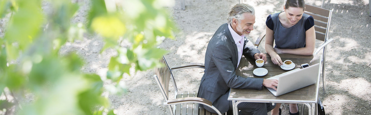 business couple sitting outdoors