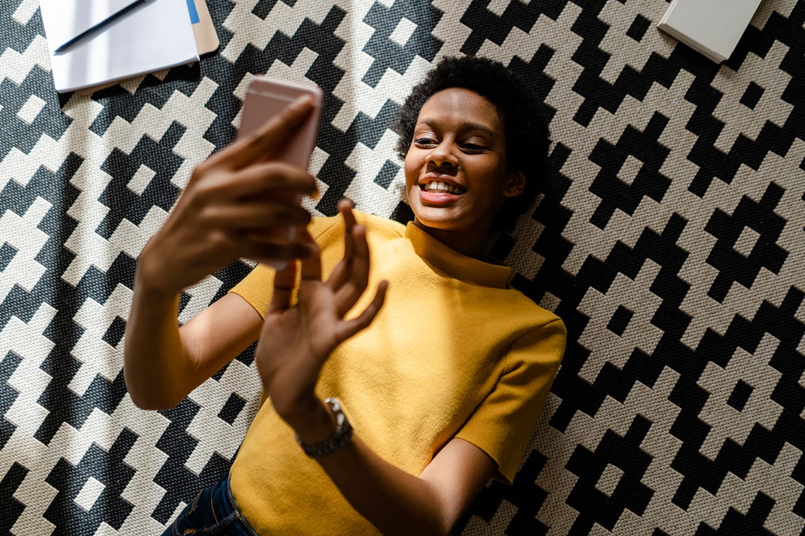woman looking at cell phone