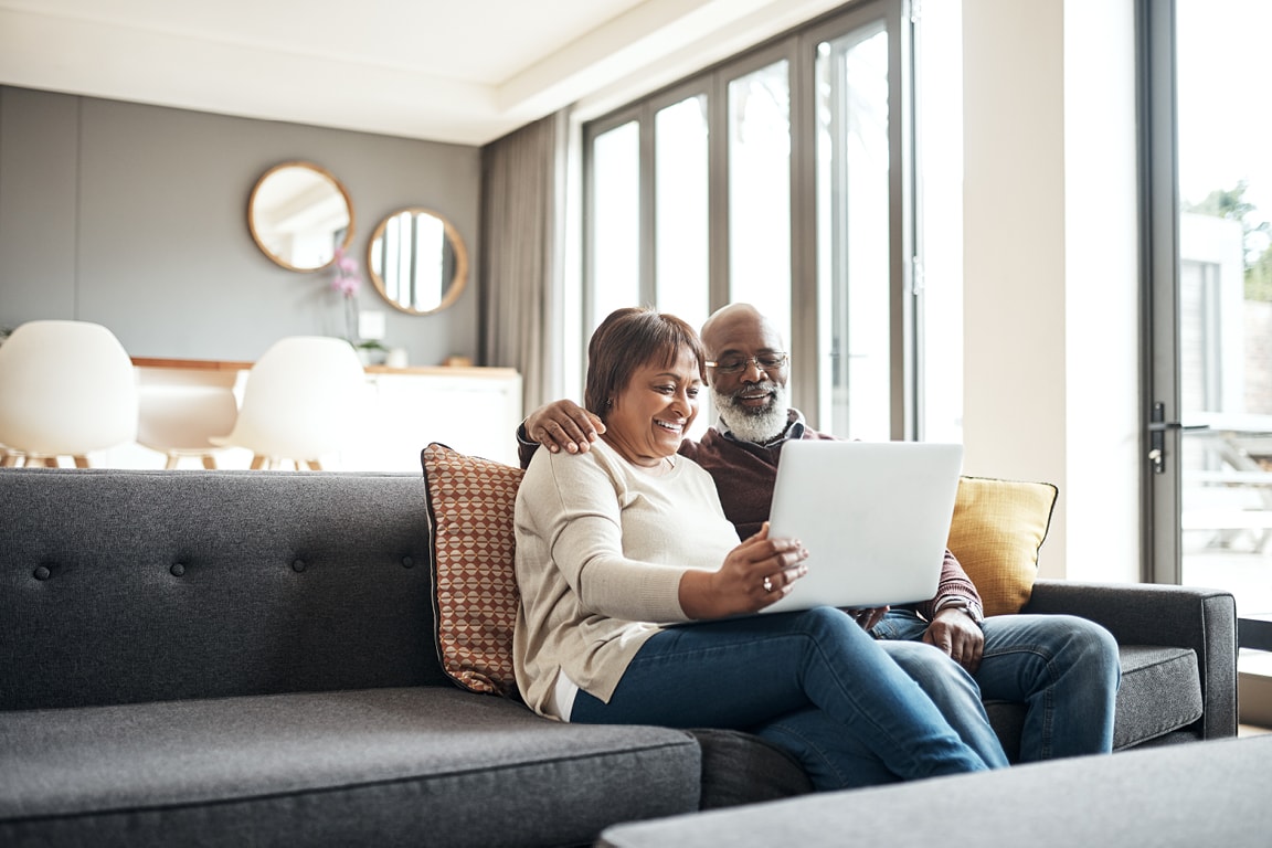 mature couple looking at laptop