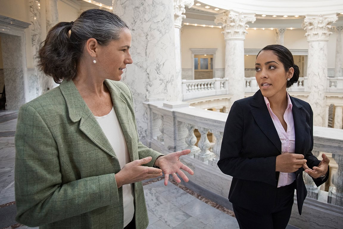 Two business women walking