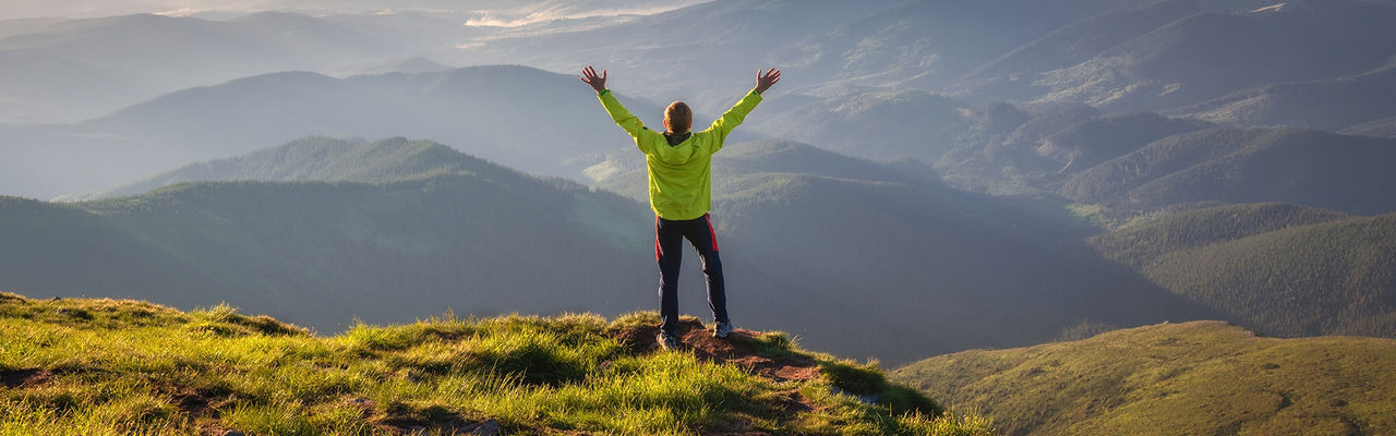 man overlooking mountains