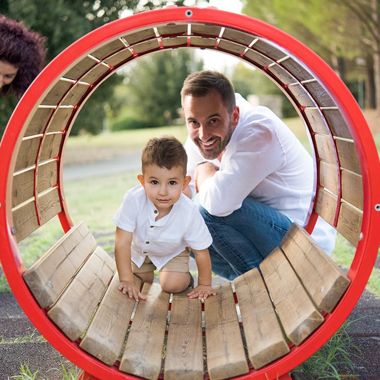 father and son playing in the park
