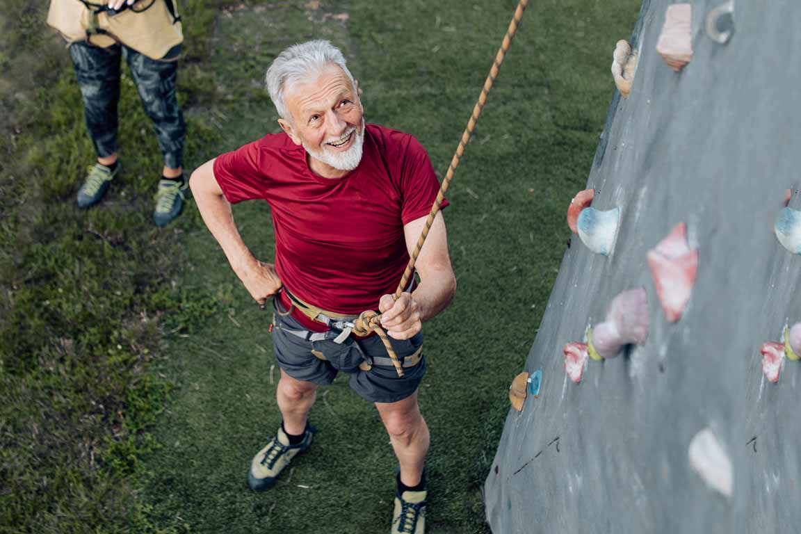 mature man about to climb