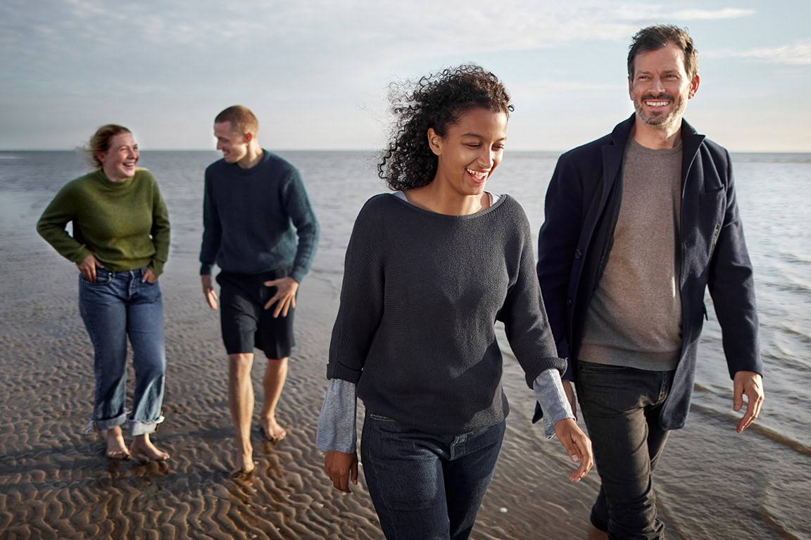 couples walking on the beach