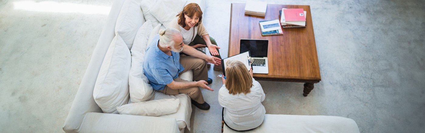 Three people engaged in a discussion