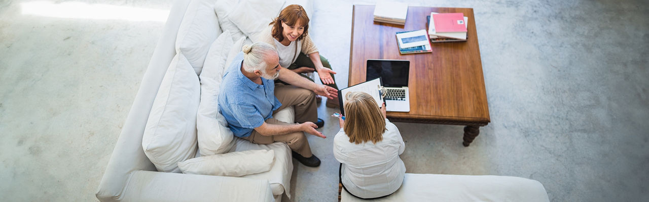 Three people engaged in a discussion