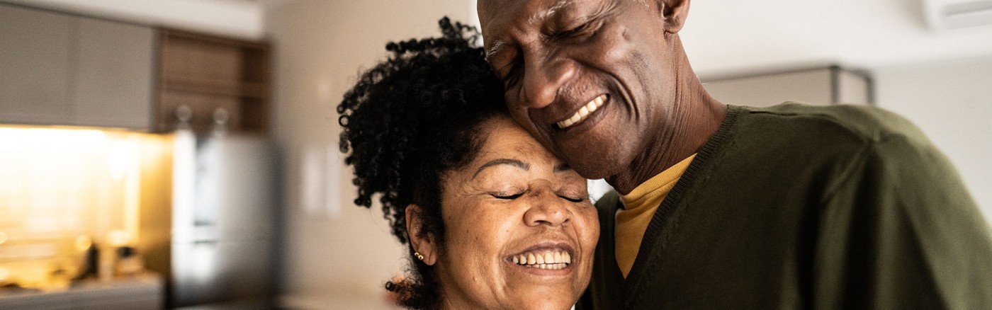a man and a woman smiling at each other