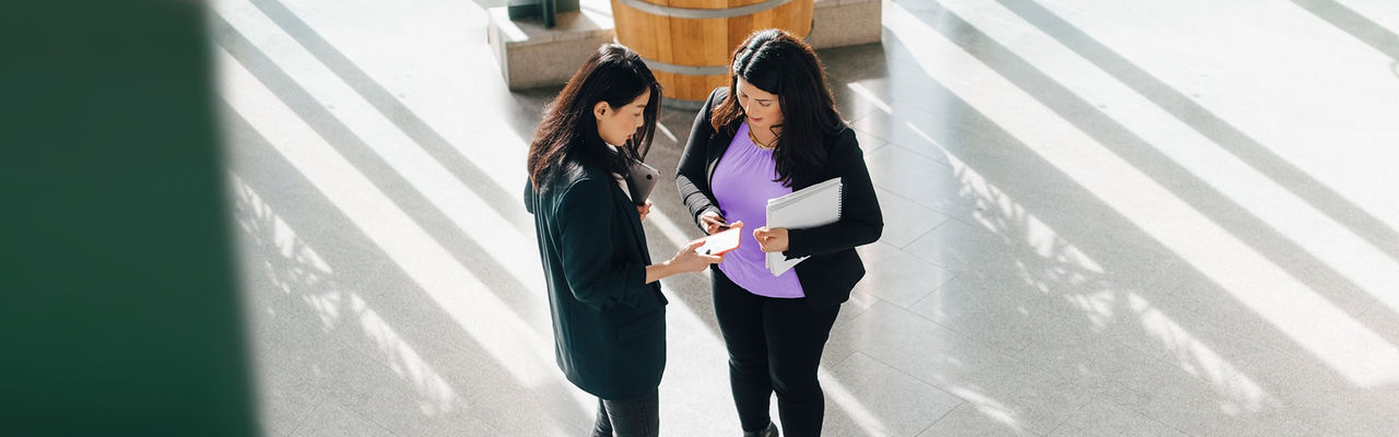Businesswomen reviewing a document