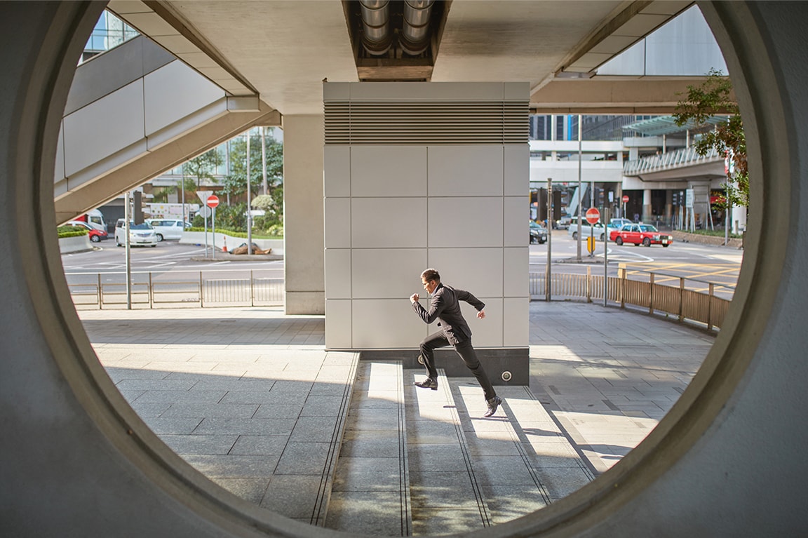 Businessman running up stairs