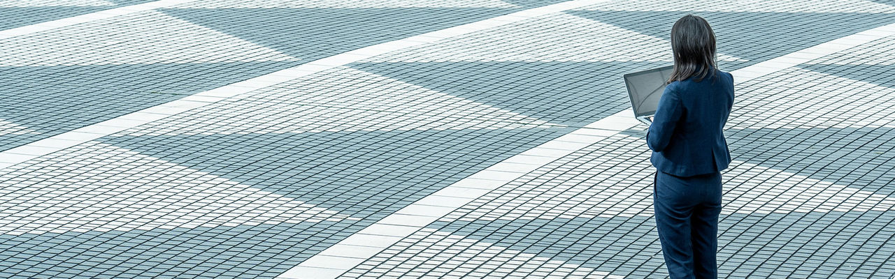 Woman standing on patterned floor