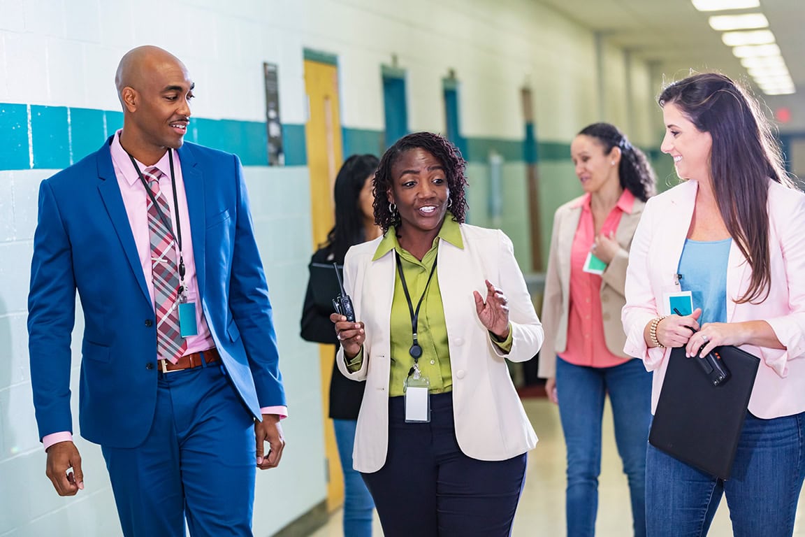 business people walking while talking