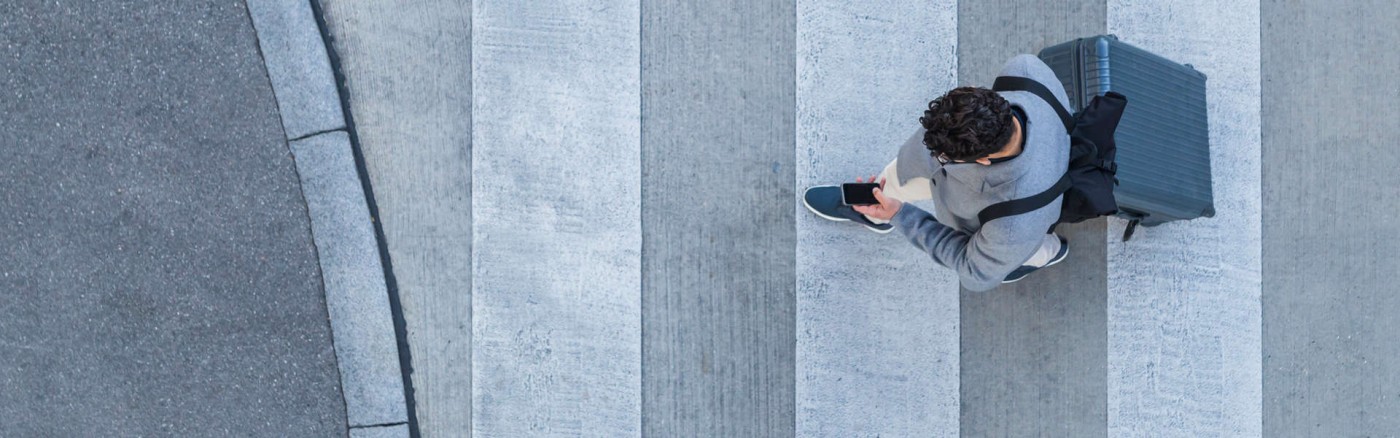 Men walking while looking at iPhone