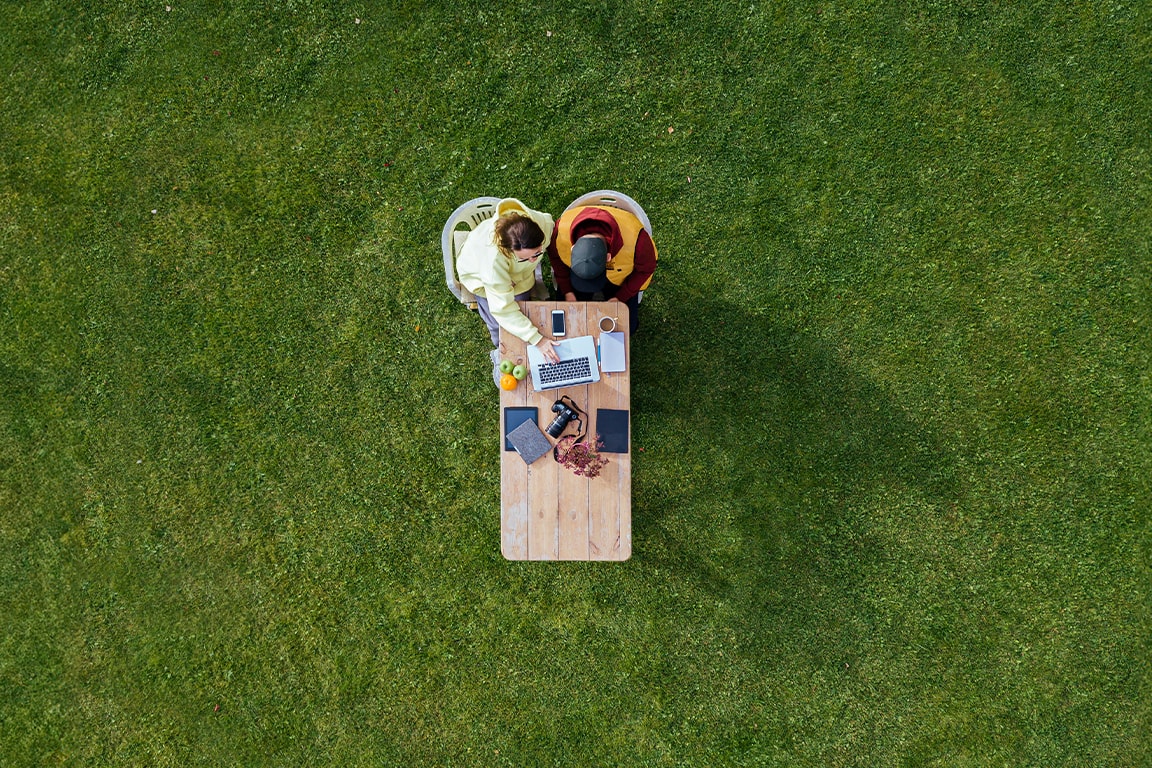a couple working outdoors 