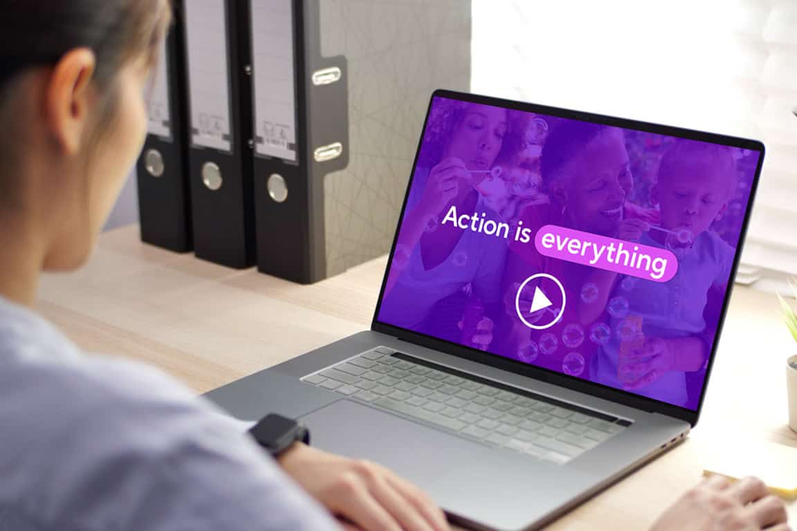 A person watching a video on a laptop