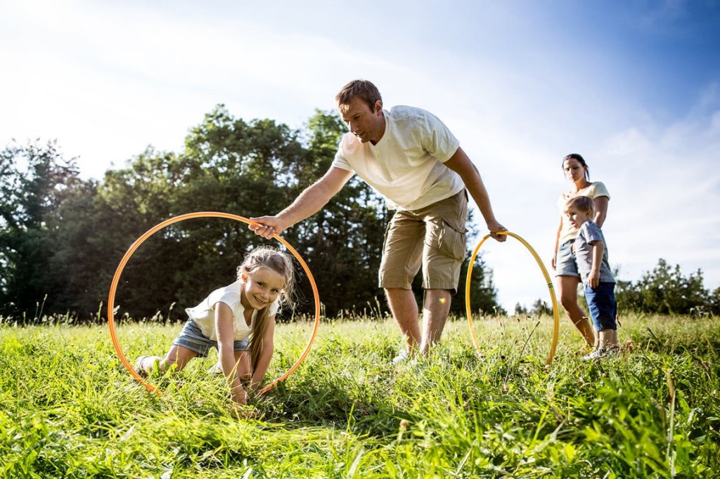 Father and kids playing outdoors