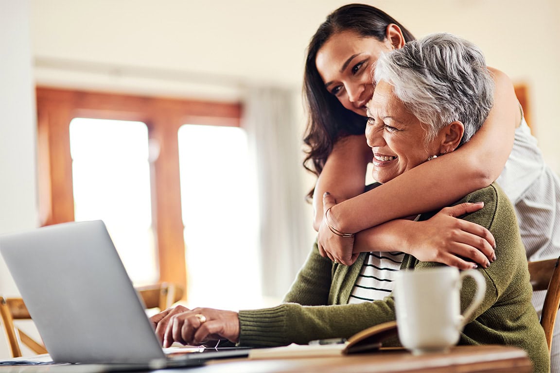 Mother and daugher using a laptop