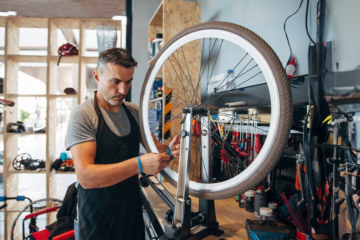 Man fixing his bike