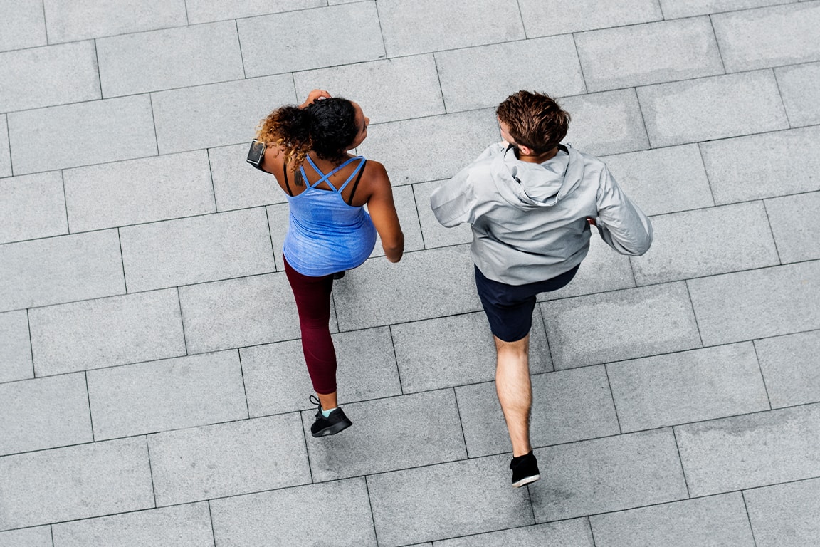 Couple running outdoors