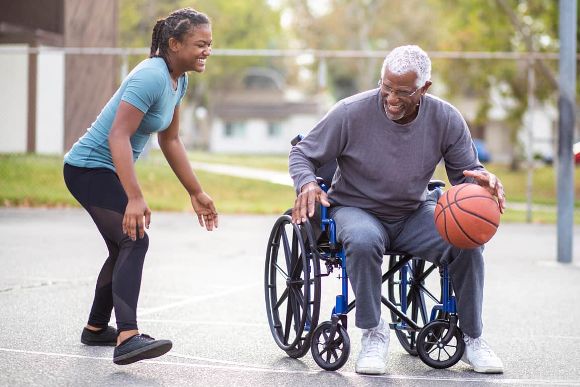 man in a wheelchair playing basketball