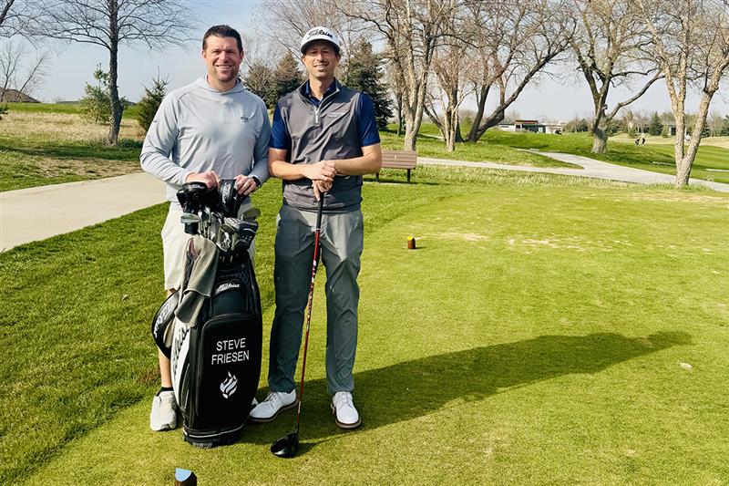 Two men on a golf course