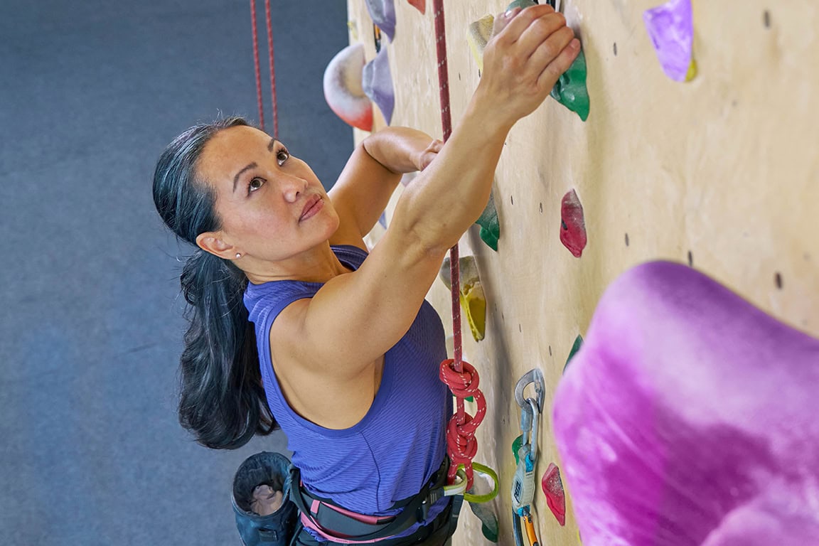 woman rock climbing