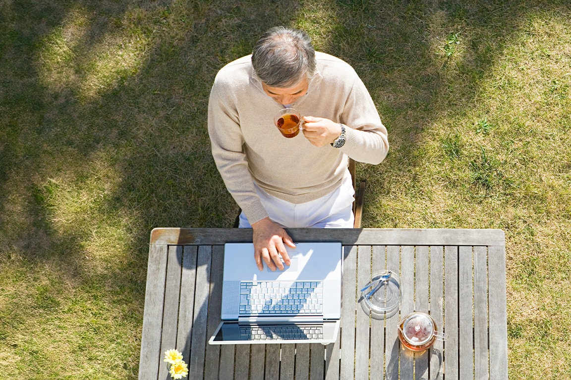 Person working on a laptop outdoors