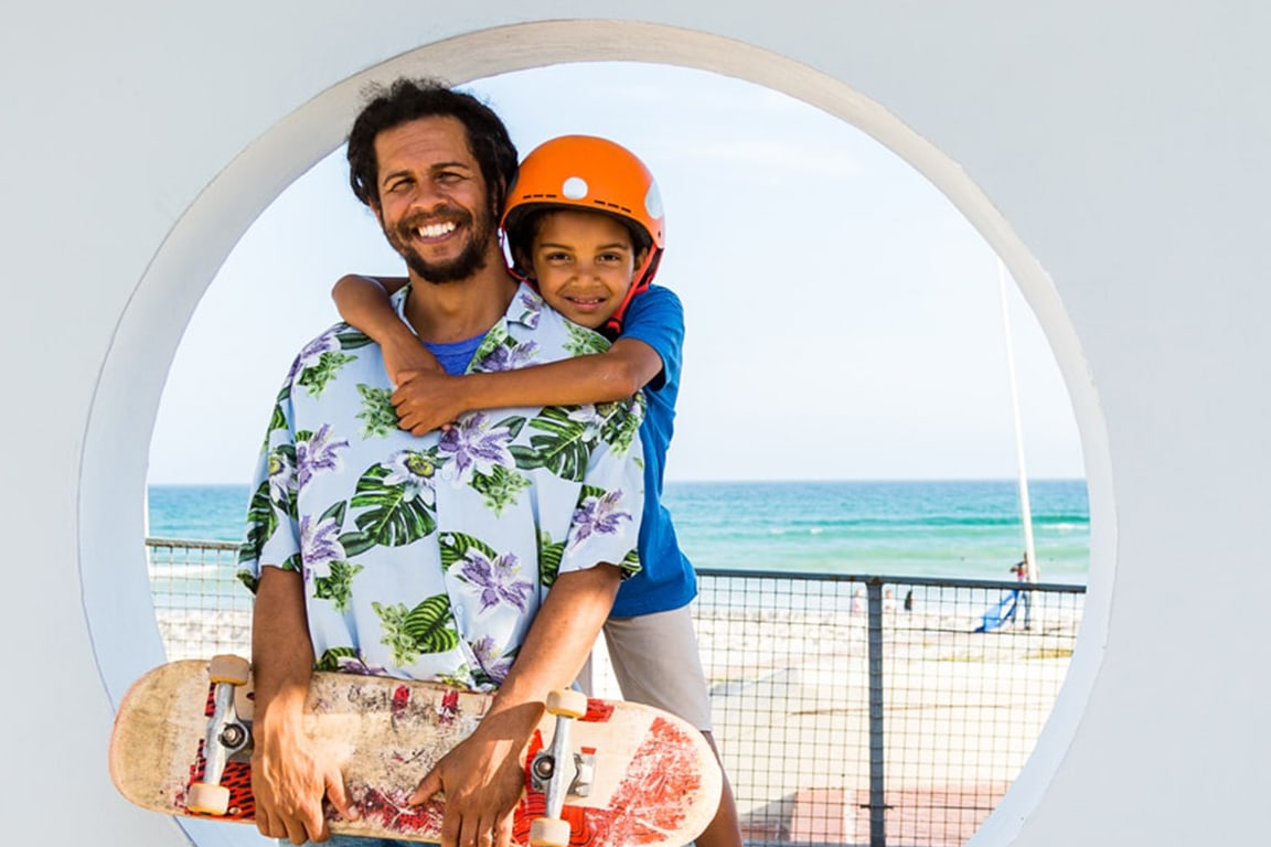 Father and Son at Skate Park by the beach