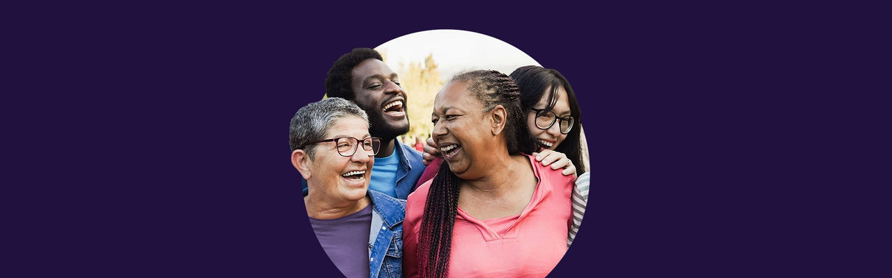 A group of 4 people smiling