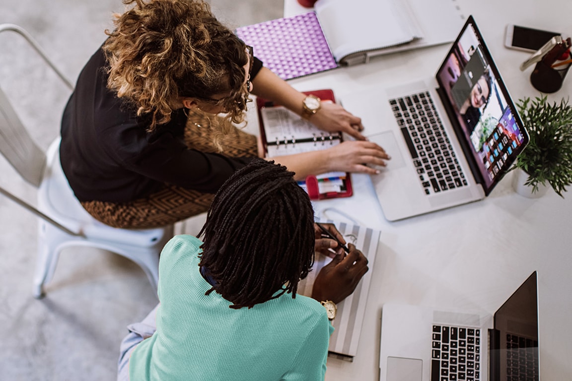 people working on a laptop