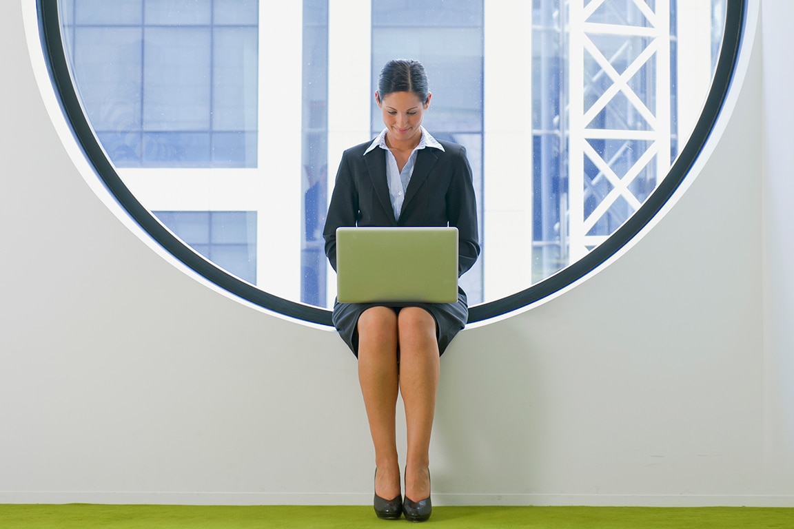 woman typing on her laptop