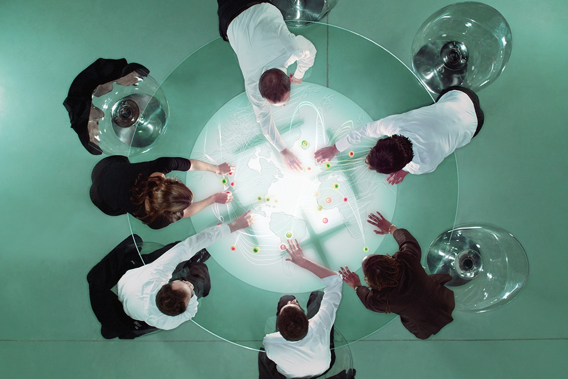 People sitting around round table top view