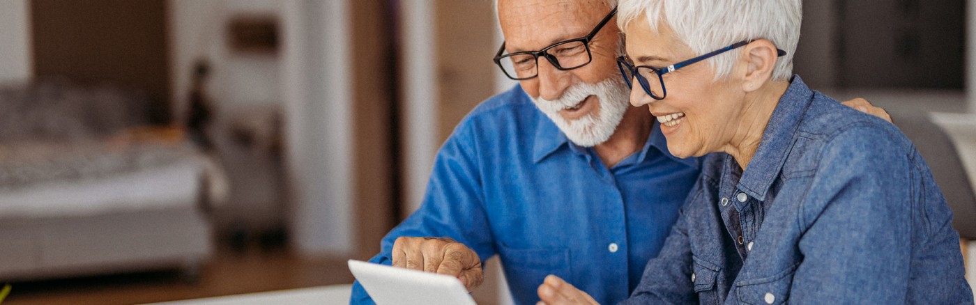 Older couple looking at laptop together