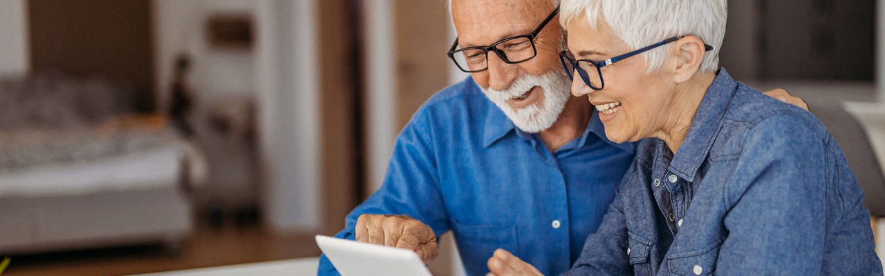 Older couple looking at laptop together