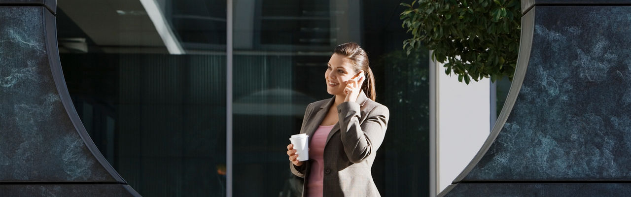 woman sitting while holding Ipad
