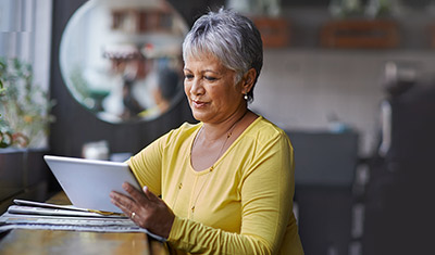 woman  looking at her ipad