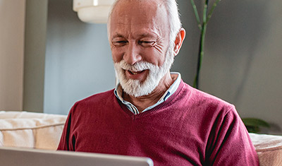 man smiling while looking at up