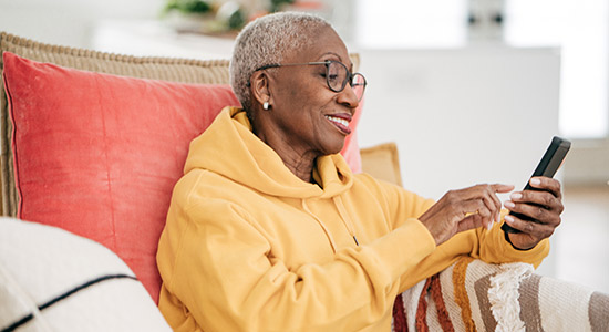 woman smiling while looking at up