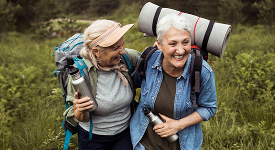 woman smiling while looking at up