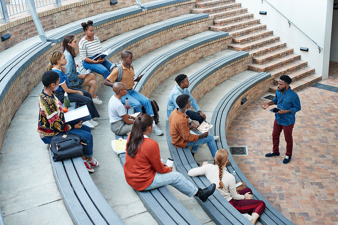 Professor Talking To Student Outside