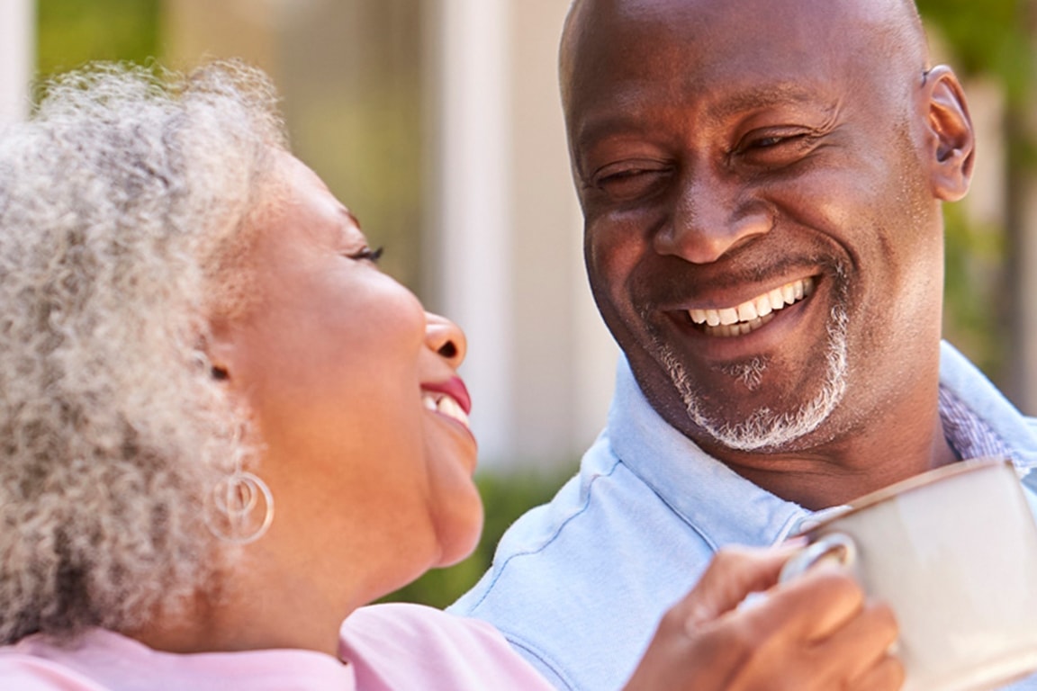 Happy women using a calculator