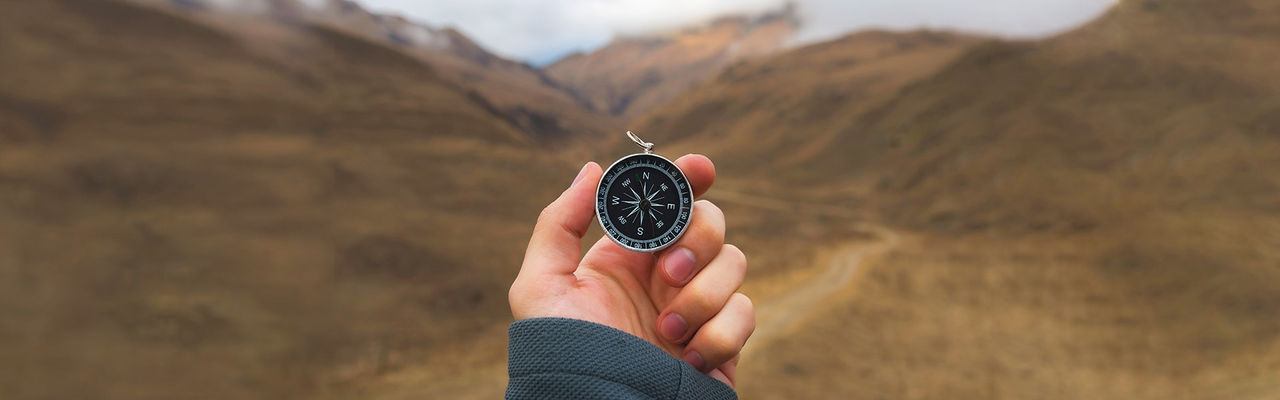 Person holding old pocket watch