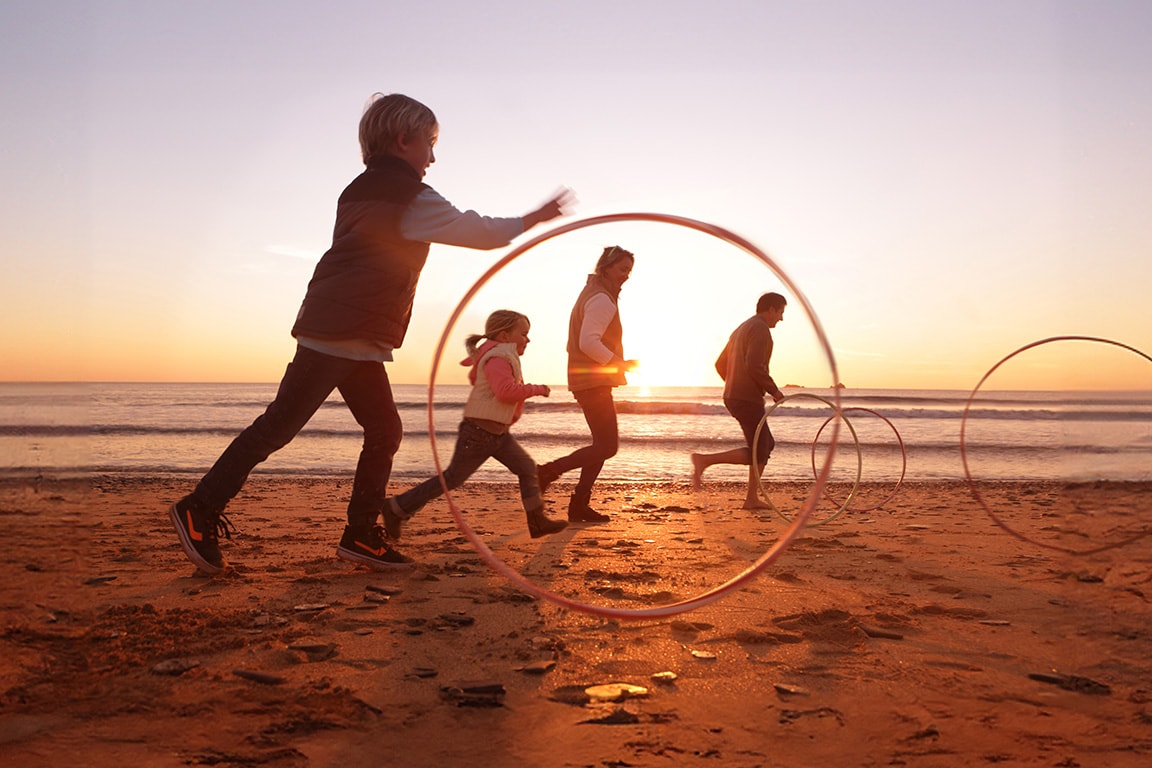 Children Playing on the Beach at Sunset 